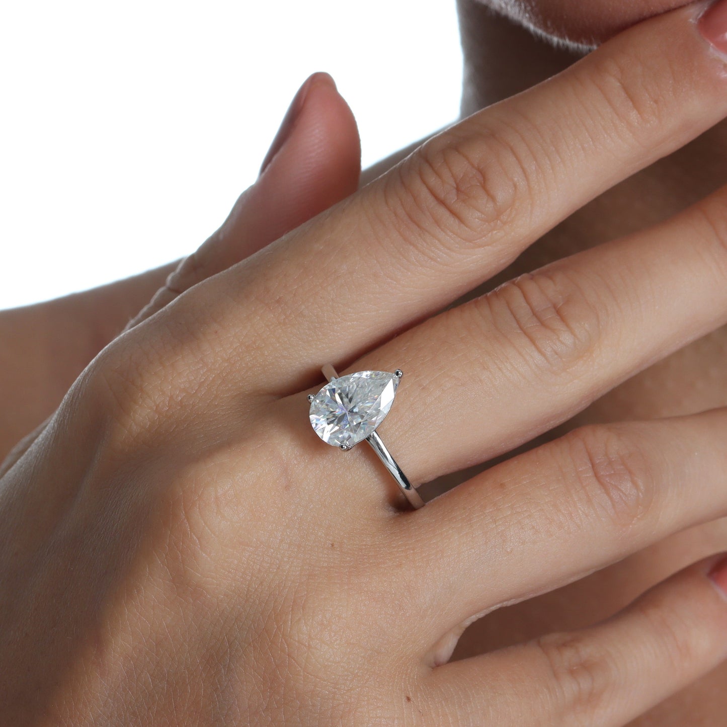Three-Prong Solitaire Pear Cut Moissanite Ring