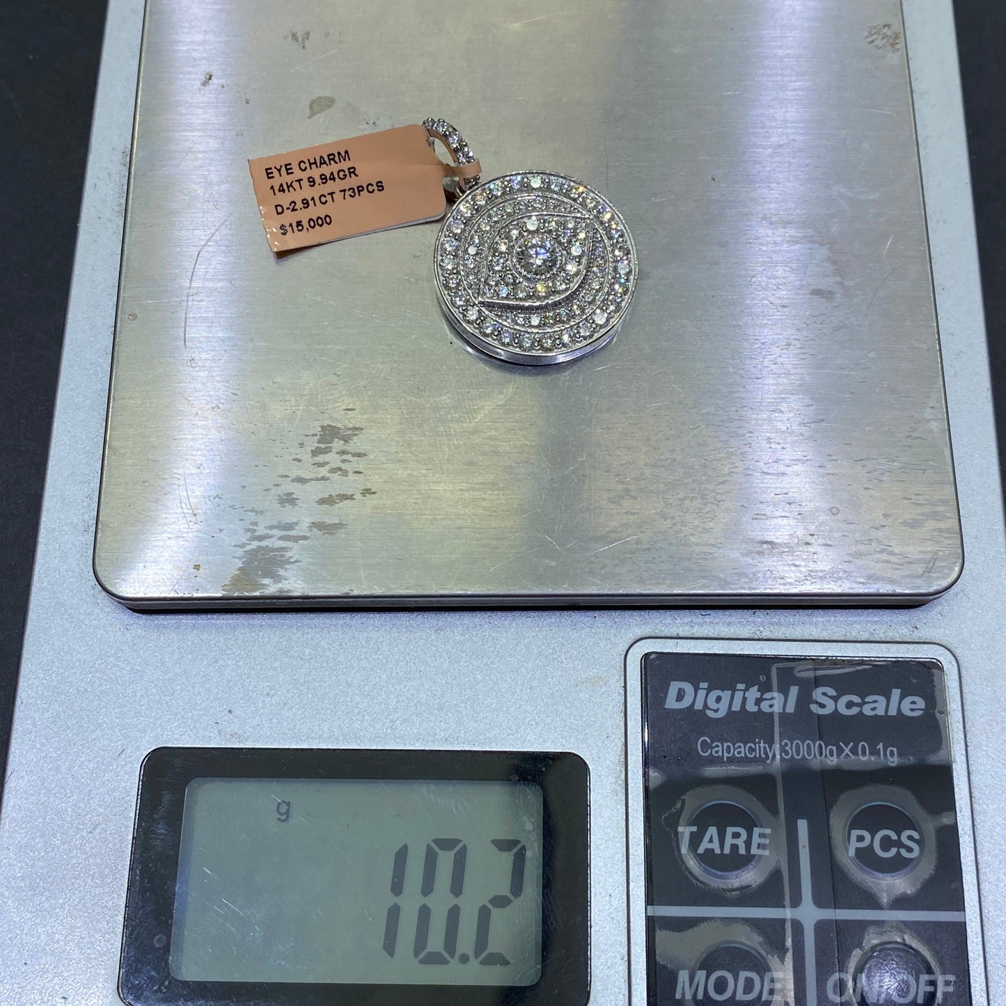 New14k “iced” 4cts Vs1 .50 carat center stone Eye pendant